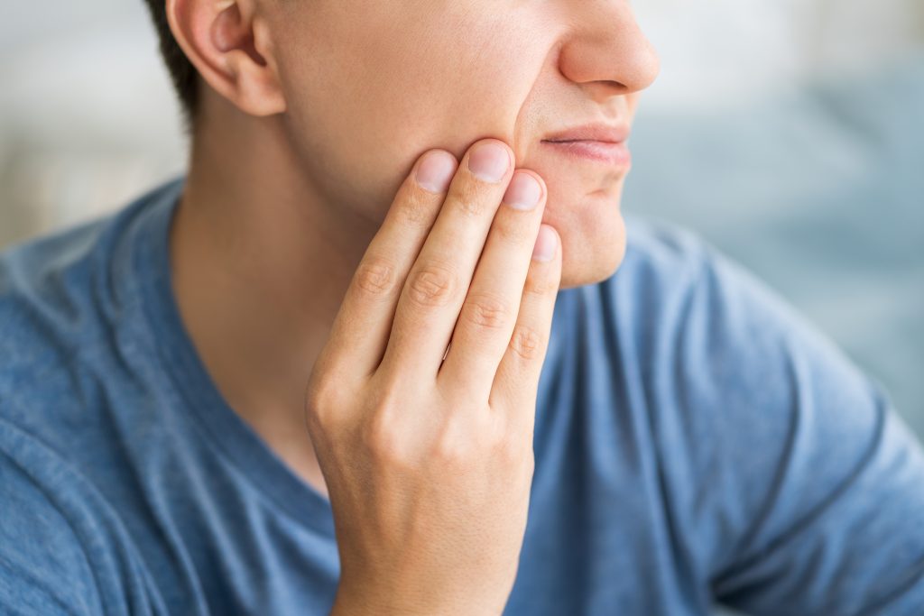 A man with toothache, periodontal disease in wisdom teeth
